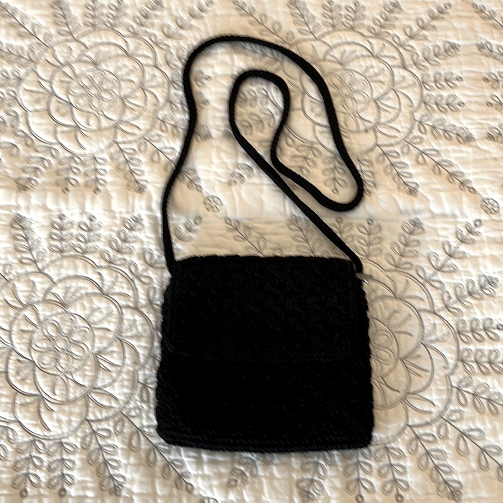 The Sak black woven crossbody. 7”x6”.